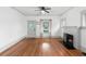 Living room featuring hardwood floors and fireplace at 448 E Church St, Deland, FL 32724