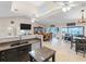 Kitchen with granite countertops and stainless steel appliances, open to dining area at 4707 S Atlantic Ave, Ponce Inlet, FL 32127