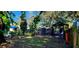 Landscaped backyard with shed and outdoor seating area at 487 Dawnview Sq, Port Orange, FL 32127
