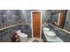 Modern bathroom with double vanity, marble walls, and a walk-in shower at 487 Dawnview Sq, Port Orange, FL 32127
