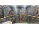 Bathroom boasting a walk-in shower, marble finishes, and modern fixtures at 487 Dawnview Sq, Port Orange, FL 32127