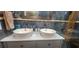 Modern bathroom with double sinks and marble backsplash at 487 Dawnview Sq, Port Orange, FL 32127