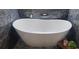 Luxurious bathroom with a freestanding tub and marble accents at 487 Dawnview Sq, Port Orange, FL 32127