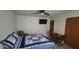 Guest bedroom featuring a bed with blue and white quilt, and a ceiling fan at 487 Dawnview Sq, Port Orange, FL 32127