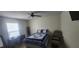 Bright bedroom with a comfortable bed and ceiling fan at 487 Dawnview Sq, Port Orange, FL 32127