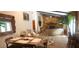 Bright dining area with wood table and chairs, adjacent to kitchen at 487 Dawnview Sq, Port Orange, FL 32127