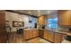 Bright kitchen featuring wood floors, granite countertops, and stainless steel appliances at 487 Dawnview Sq, Port Orange, FL 32127