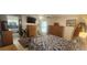 Cozy main bedroom with a ceiling fan, natural light, and an ensuite bath at 487 Dawnview Sq, Port Orange, FL 32127