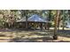 Wooden park pavilion with picnic tables at 487 Dawnview Sq, Port Orange, FL 32127
