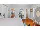 Main bedroom with view of kitchen and bath, hardwood floors at 509 Faulkner St, New Smyrna Beach, FL 32168