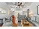 Bright living room with hardwood floors and coffered ceilings at 509 Faulkner St, New Smyrna Beach, FL 32168