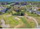 Aerial view of a golf course community with lush greenery and residential homes at 55 Fairway Dr # 3D, Debary, FL 32713