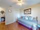 Comfortable bedroom with wood flooring, closet, and bright window at 55 Fairway Dr # 3D, Debary, FL 32713