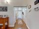 A cozy entryway features hardwood floors, a decorative rug, and neutral-colored walls at 55 Fairway Dr # 3D, Debary, FL 32713