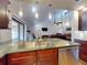 Updated kitchen that opens to the living room with stainless steel appliances and granite counter tops at 55 Fairway Dr # 3D, Debary, FL 32713