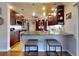 The kitchen includes ample cabinet space, stainless appliances, and seating at the bar at 55 Fairway Dr # 3D, Debary, FL 32713
