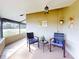 Enclosed sunroom with comfortable seating and a view of the outdoors at 55 Fairway Dr # 3D, Debary, FL 32713