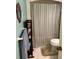 Simple bathroom with shower, toilet and storage at 575 Lantern Ln, Orange City, FL 32763