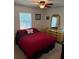 Bedroom with double bed, dresser, and ceiling fan at 575 Lantern Ln, Orange City, FL 32763