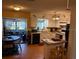 Efficient kitchen with island and view into dining area at 575 Lantern Ln, Orange City, FL 32763