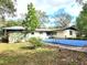 Backyard with inground pool and storage shed at 600 S Montgomery Ave, Deland, FL 32720