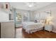 Bright bedroom with a comfortable bed, hardwood floors, and calming decor at 601 Autumn Fern Ln, Deland, FL 32720