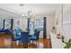 Modern dining room featuring hardwood floors and a glass-top dining table at 601 Autumn Fern Ln, Deland, FL 32720