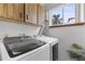 Bright laundry room with Samsung washer and dryer at 63 St Anne Cir, Ormond Beach, FL 32176