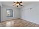 Bright bedroom with laminate wood floors and sliding doors at 689 Wellington Station Blvd # 41, Ormond Beach, FL 32174