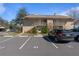 Condo building exterior with parking and surrounding landscape at 689 Wellington Station Blvd # 41, Ormond Beach, FL 32174