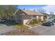 Exterior view of condo building with parking and landscaping at 689 Wellington Station Blvd # 41, Ormond Beach, FL 32174