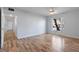 Bright living room with laminate floors and large window at 689 Wellington Station Blvd # 41, Ormond Beach, FL 32174