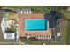 Community pool with surrounding lounge chairs and patio at 689 Wellington Station Blvd # 41, Ormond Beach, FL 32174