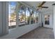 Sunroom featuring ample windows, carpet flooring, and a ceiling fan at 689 Wellington Station Blvd # 41, Ormond Beach, FL 32174