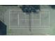 Community tennis court with markings and surrounding fence at 689 Wellington Station Blvd # 41, Ormond Beach, FL 32174