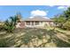 Large backyard with grassy area and palm trees at 783 S Atmore Cir, Deltona, FL 32725