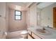 Bathroom features a tub, sink, and toilet at 783 S Atmore Cir, Deltona, FL 32725