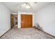Bedroom with wood closet doors and carpet at 783 S Atmore Cir, Deltona, FL 32725