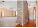 Living room with brick fireplace and carpeted floor at 783 S Atmore Cir, Deltona, FL 32725