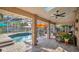 Inviting pool area with covered patio and seating at 980 E Pennsylvania Ave, Deland, FL 32724