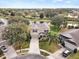 Two-story house situated on a corner lot, with a lake and golf course nearby at 10025 Scottish Pines Ct, Orlando, FL 32832