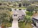 Two-story house with a large backyard and a lake view at 10025 Scottish Pines Ct, Orlando, FL 32832