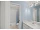 Clean bathroom with light blue walls, a vanity, and a shower/tub combo at 10025 Scottish Pines Ct, Orlando, FL 32832