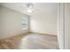 Bright bedroom featuring wood-look floors and a ceiling fan at 10025 Scottish Pines Ct, Orlando, FL 32832