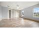 Spacious bedroom with large windows, wood-look floors, and a ceiling fan at 10025 Scottish Pines Ct, Orlando, FL 32832