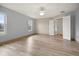 Spacious bedroom with hardwood floors, large windows and ceiling fan at 10025 Scottish Pines Ct, Orlando, FL 32832