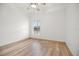 Bedroom featuring wood-look floors and a window with natural light at 10025 Scottish Pines Ct, Orlando, FL 32832