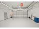 Garage with overhead storage and epoxy floor at 10025 Scottish Pines Ct, Orlando, FL 32832