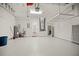 Spacious garage with overhead storage and utility area at 10025 Scottish Pines Ct, Orlando, FL 32832