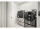 Laundry room with stainless steel washer and dryer at 10025 Scottish Pines Ct, Orlando, FL 32832